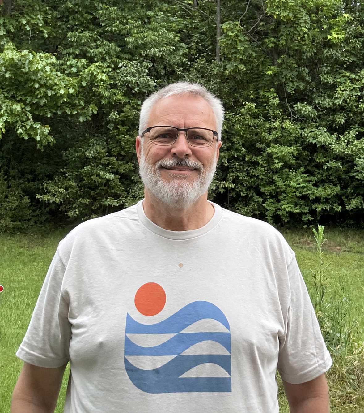 The host outside in a casual T-shirt